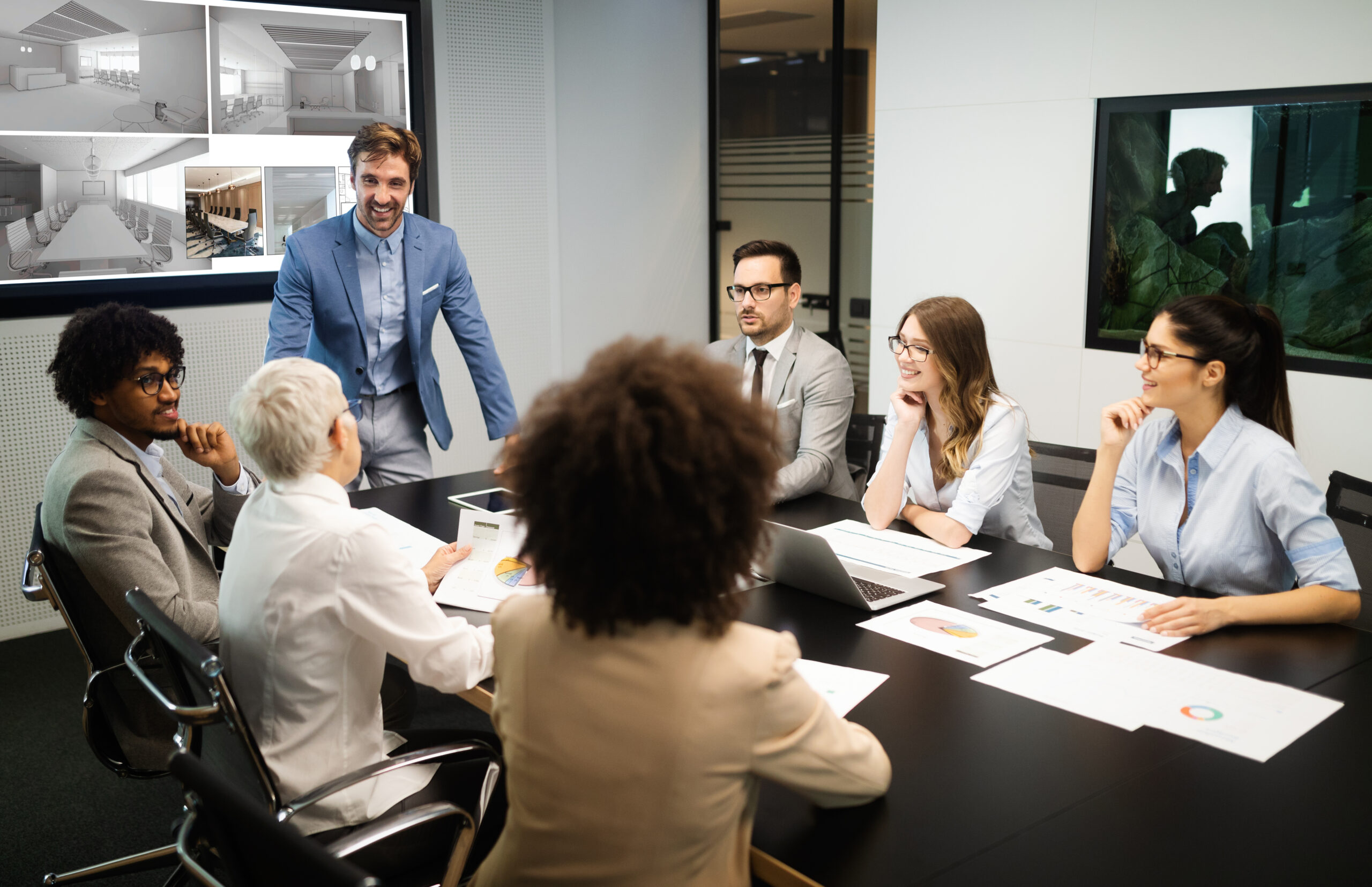 A group of people sitting around a table.